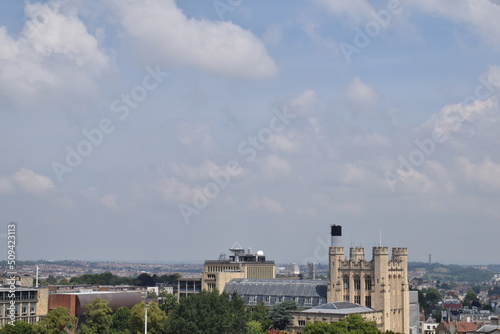 Aerial view of Bristol city during sunny day with sky and clouds.
