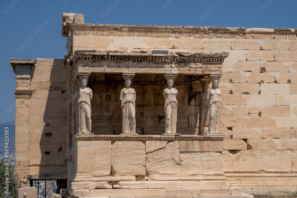 Colonnade of the caryatids in the Acropolis of Athens, Greece, during a sunny summer day