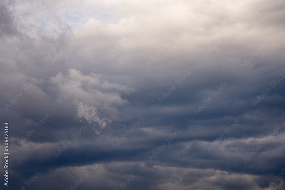 Fototapeta premium The sky is covered with gray storm clouds as a natural background.