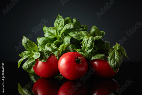 Fresh tomatoes and green basil.