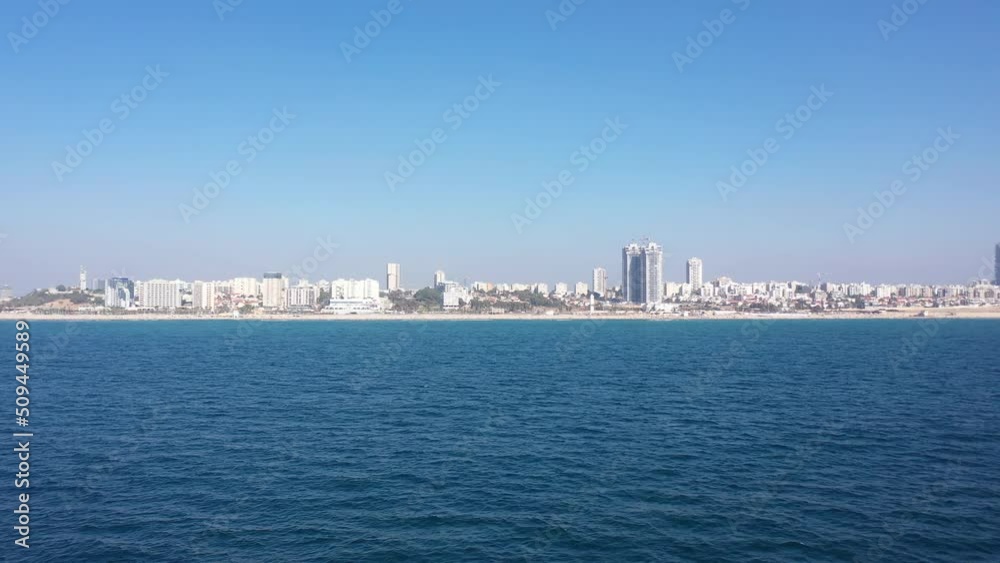 Camera flying fast over sea toward beach, aerial view
Drone view from Ashdod city shorline
Camera flying fast over sea toward beach, aerial view
Drone view from Ashdod city shorline
