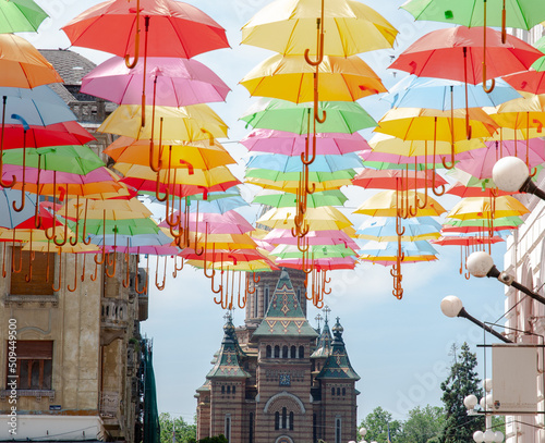 View an Orthodox Romania church below umbrellas