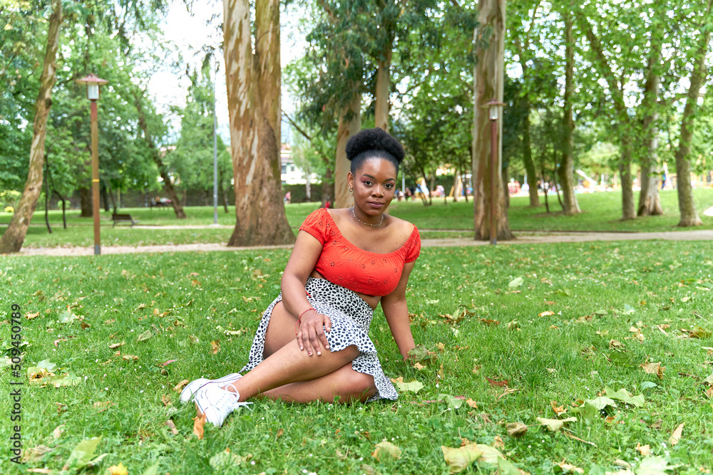 African american woman sitting in the garden African american woman sitting in the garden