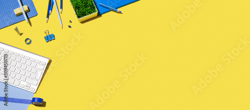 School background. Various school supplies on yellow background. Surreal composition. Stylish banner. 