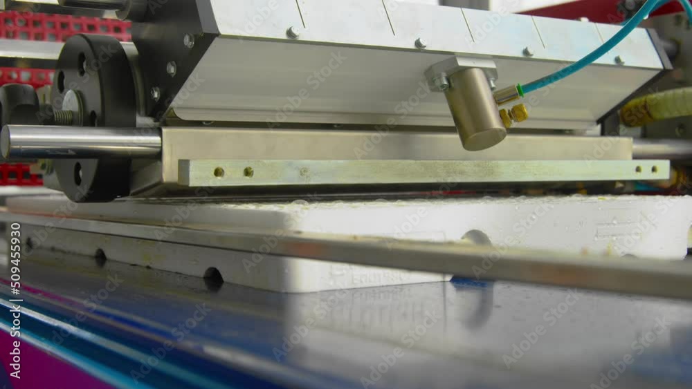 Close-up of filling cassettes with vermiculite at the factory. Close-up of filling cassettes with vermiculite at the factory.