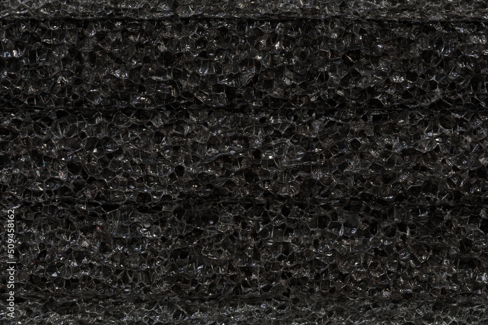 Fototapeta premium Gray black macro metallic packing material texture background