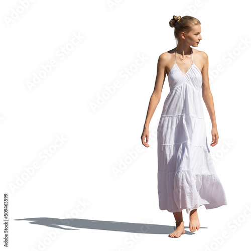 Young woman in a long summer dress walking barefoot, isolated on white background