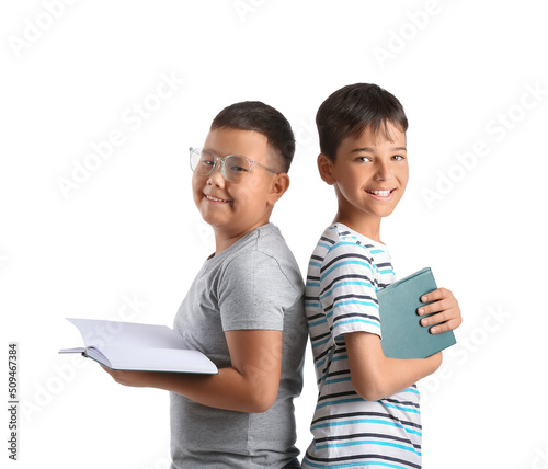 Little boys with books on w...