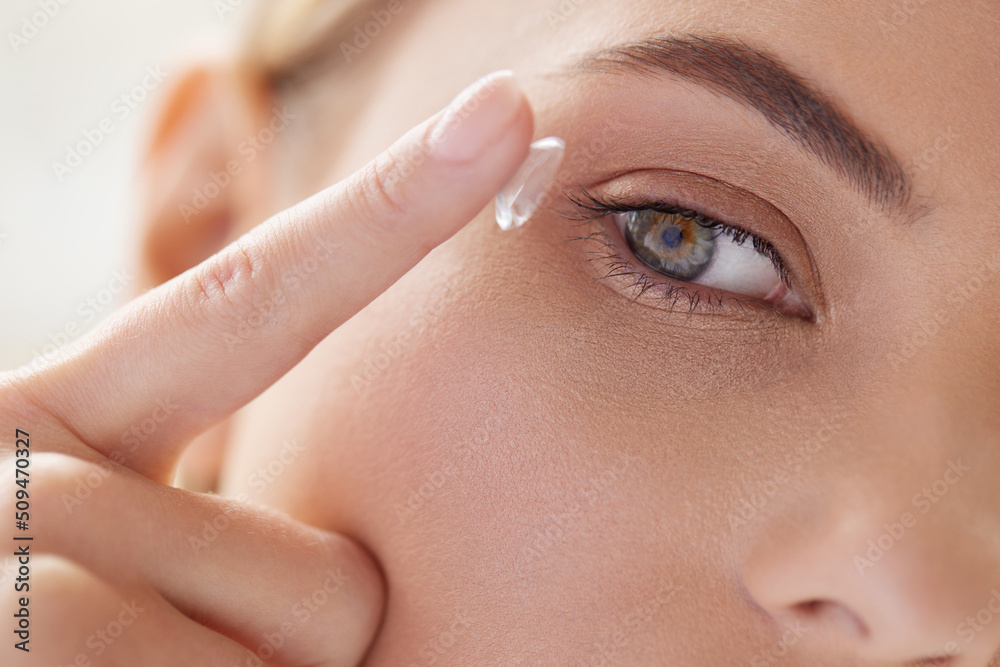 Contact Eye Lens. Cropped of Woman Applying Eye Contacts on her Eyes. Attentive Girl with Natural Make up Putting Eye Lens at her Blue Eyes. Ophthalmology Concept Contact Eye Lens. Cropped of Woman Applying Eye Contacts on her Eyes. Attentive Girl with Natural Make up Putting Eye Lens at her Blue Eyes. Ophthalmology Concept