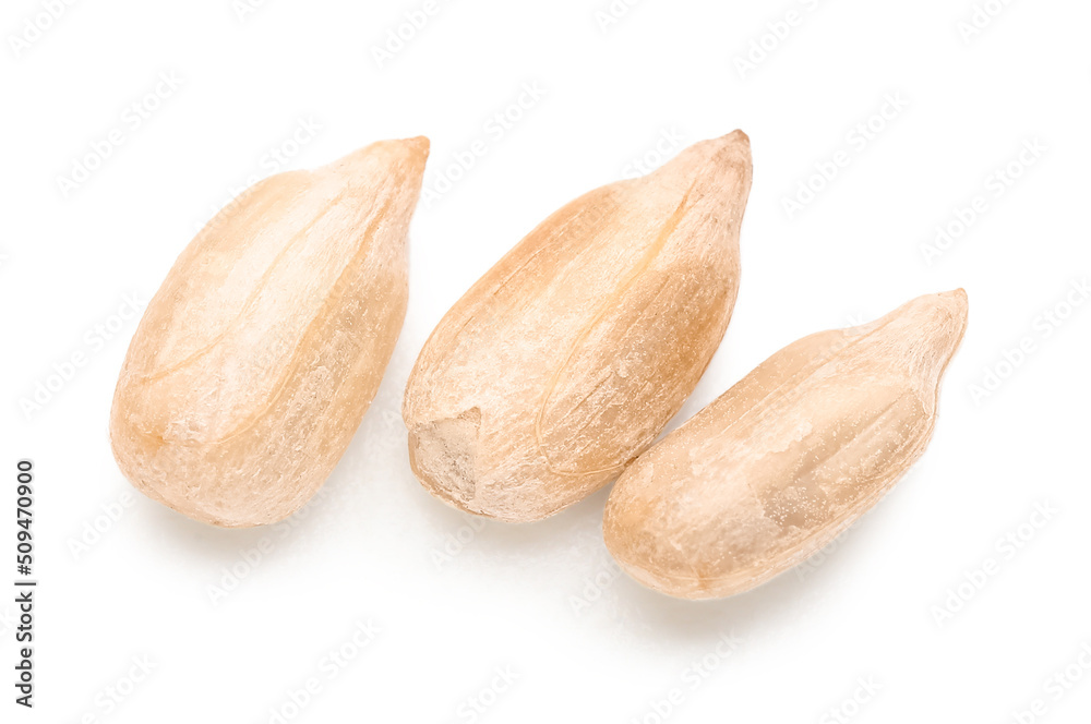 Peeled sunflower seeds on white background, top view Peeled sunflower seeds on white background, top view