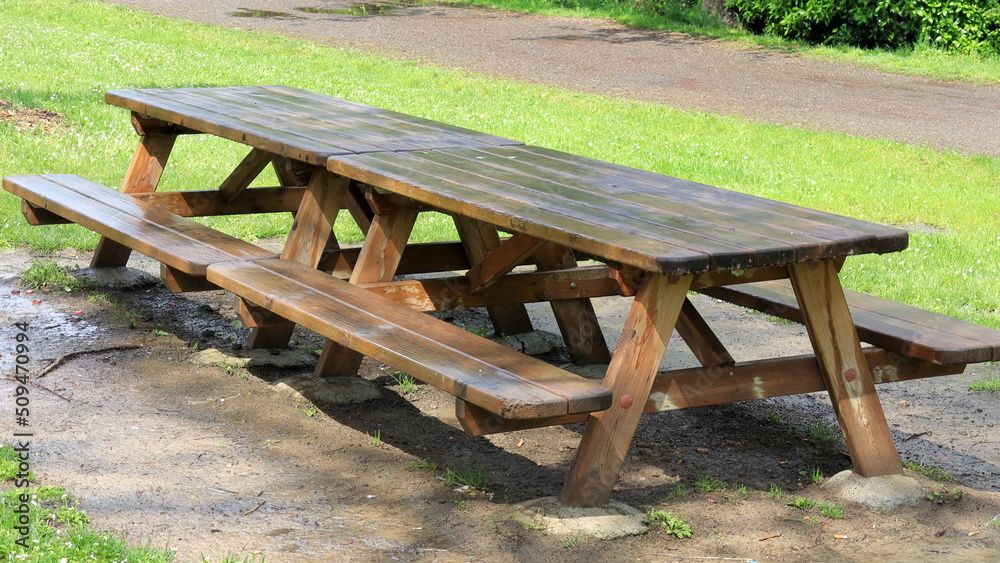 wet picnic table after rain in the park wet picnic table after rain in the park