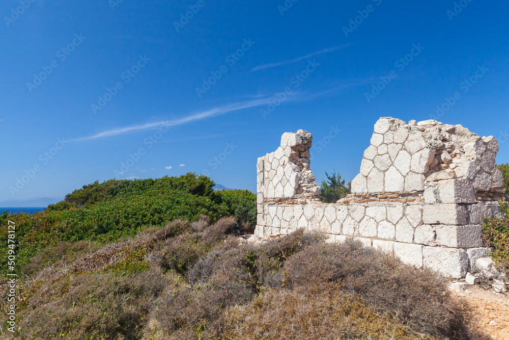 Greek summer landscape with ruins of old house
