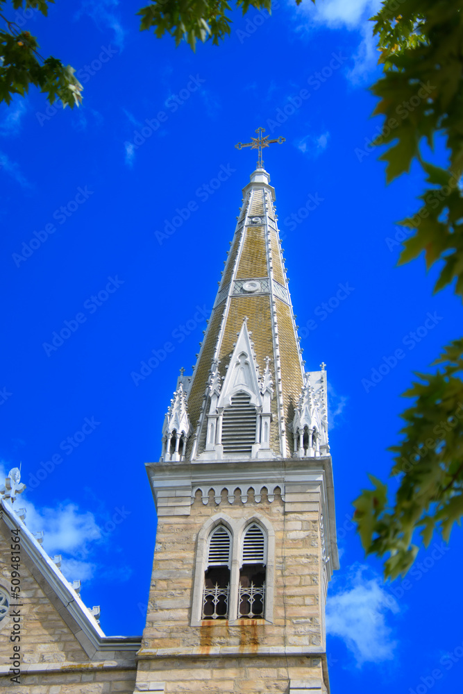 Nice steeple of a church under a blue sky in Quebec, Canada