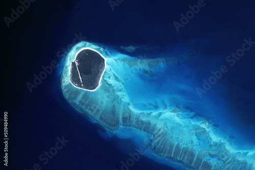 Island in the ocean from space. Elements of this image furnished by NASA photo