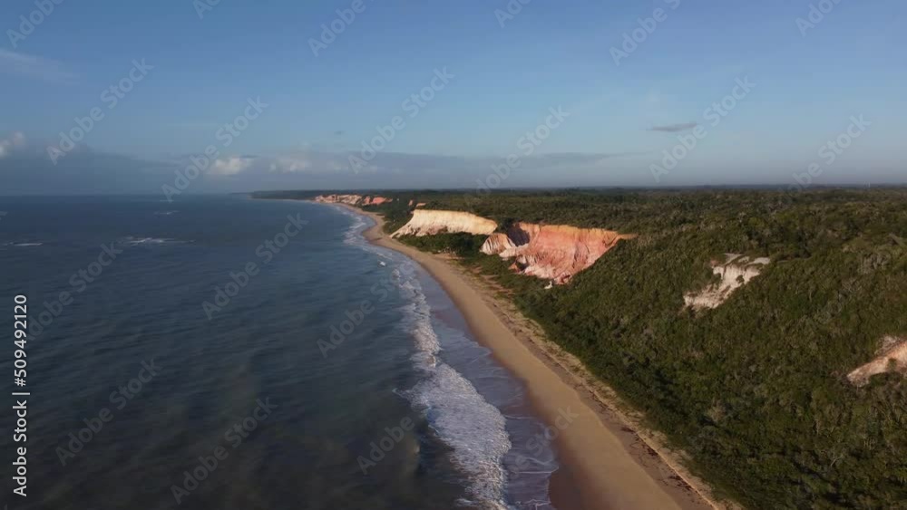 Beautiful and high nature cliffs of bahia in front of the beach - aerial Drone View - Arraial D'Ajuda, Porto Seguro, Bahia - Atlantic Forest Beautiful and high nature cliffs of bahia in front of the beach - aerial Drone View - Arraial D'Ajuda, Porto Seguro, Bahia - Atlantic Forest