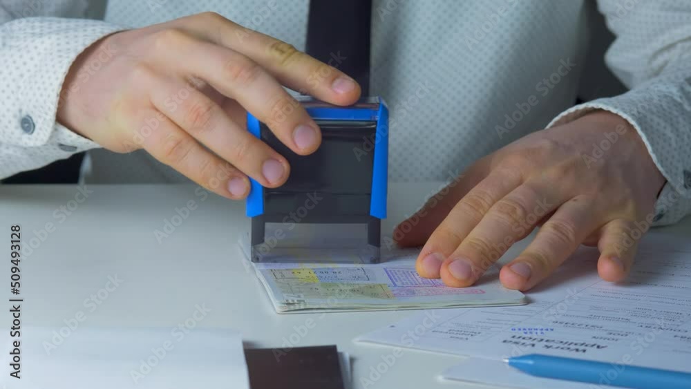 Border officer stamping travelling passport, visa approval on checkpoint. Department of homeland security, emigration and immigration. Politics and government, permit. Refugee visa or asylum status