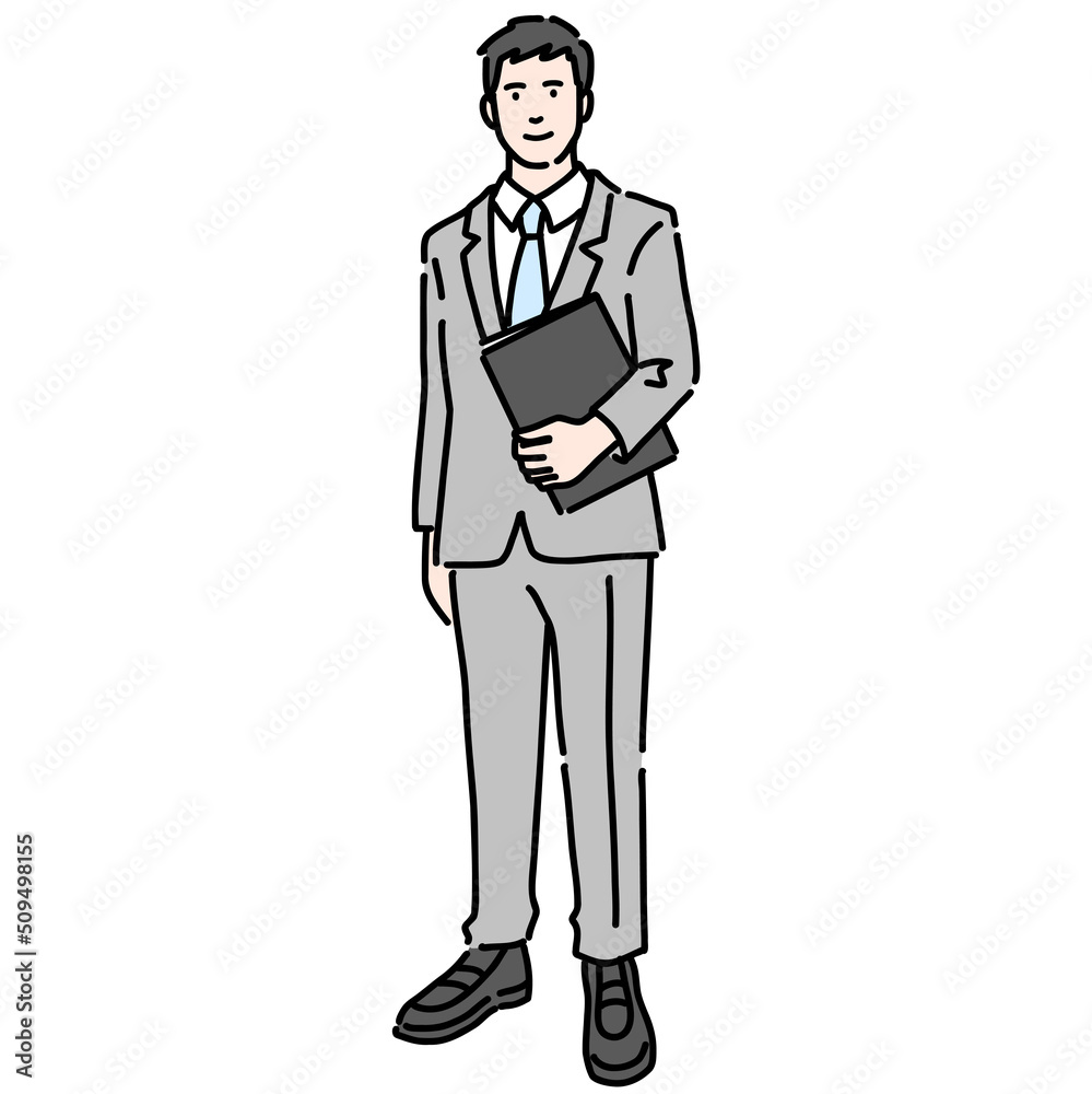 資料を持って笑顔で立っているスーツを着た若い男性