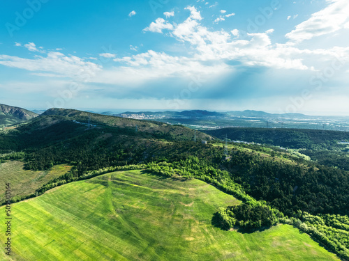 landscape with green field and blue sky