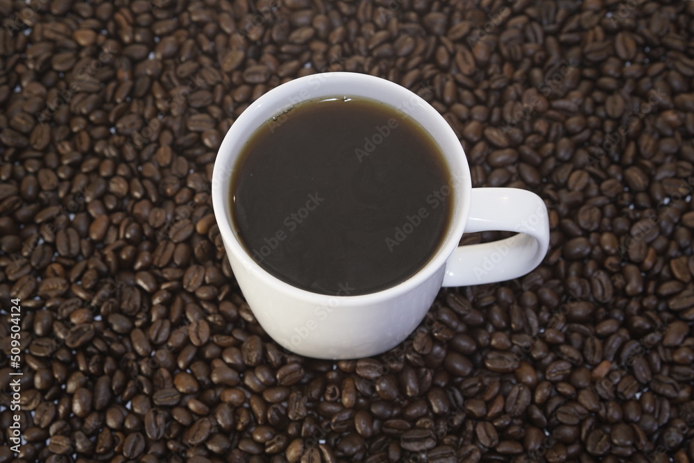 Fototapeta premium Cup of coffee and coffee beans, caffeine