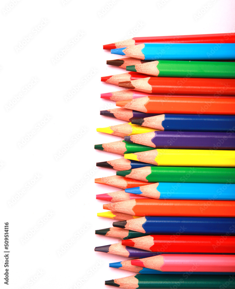 close up photo of a collection of colourful wooden pencil, art supplies. isolated on studio background with copy space. close up photo of a collection of colourful wooden pencil, art supplies. isolated on studio background with copy space.