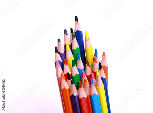 close up photo of a collection of colourful wooden pencil, art supplies. isolated on studio background with copy space.