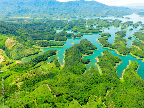 Morning at the Ta Dung lake or Dong Nai 3 lake with green hills and mountains. Travel and landscape concept. Travel concept. photo