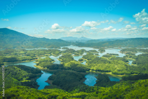 Morning at the Ta Dung lake or Dong Nai 3 lake with green hills and mountains. Travel and landscape concept. Travel concept.