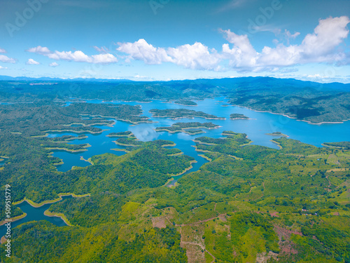 Morning at the Ta Dung lake or Dong Nai 3 lake with green hills and mountains. Travel and landscape concept. Travel concept. photo