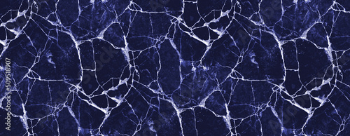 Marble or agate texture. Natural stone pattern with irregular veins. Panoramic background in navy blue tones. 