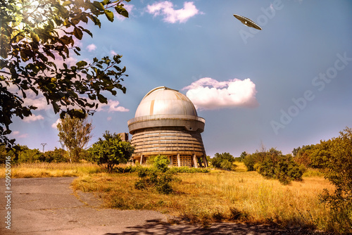 UFO flies in the sky above the telescope of the astronomical observatory in Armenia (Byurakan), 3d illustration photo