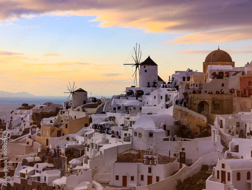 Banner travel in Santorini, Greece. Picturesq view of sunset sky scene traditional cycladic Santorini houses  blue background