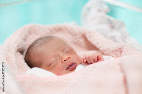 newborn baby face closeup Sleeping in table in hospital