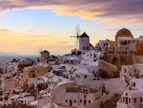 Banner travel in Santorini, Greece. Picturesq view of sunset sky scene traditional cycladic Santorini houses blue background