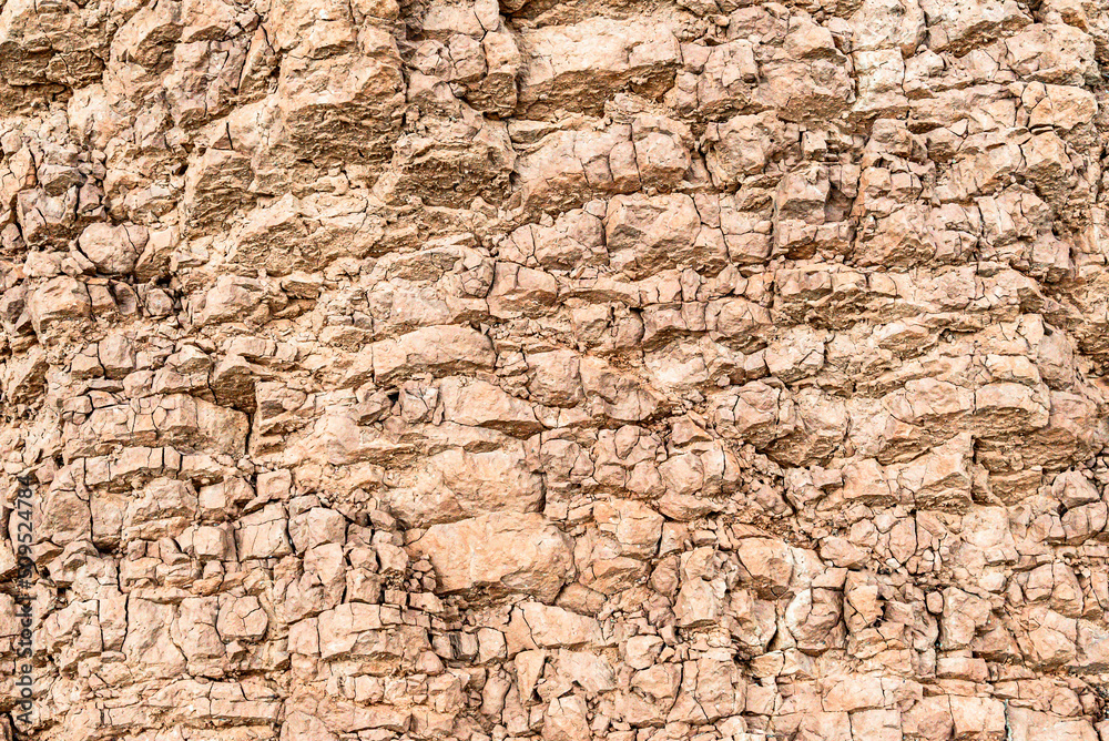 Mountain cracked earth wall background. texture, natural Mountain cracked earth wall background. texture, natural
