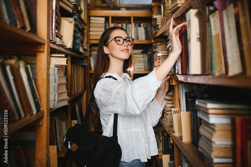 Beautiful girl in a library