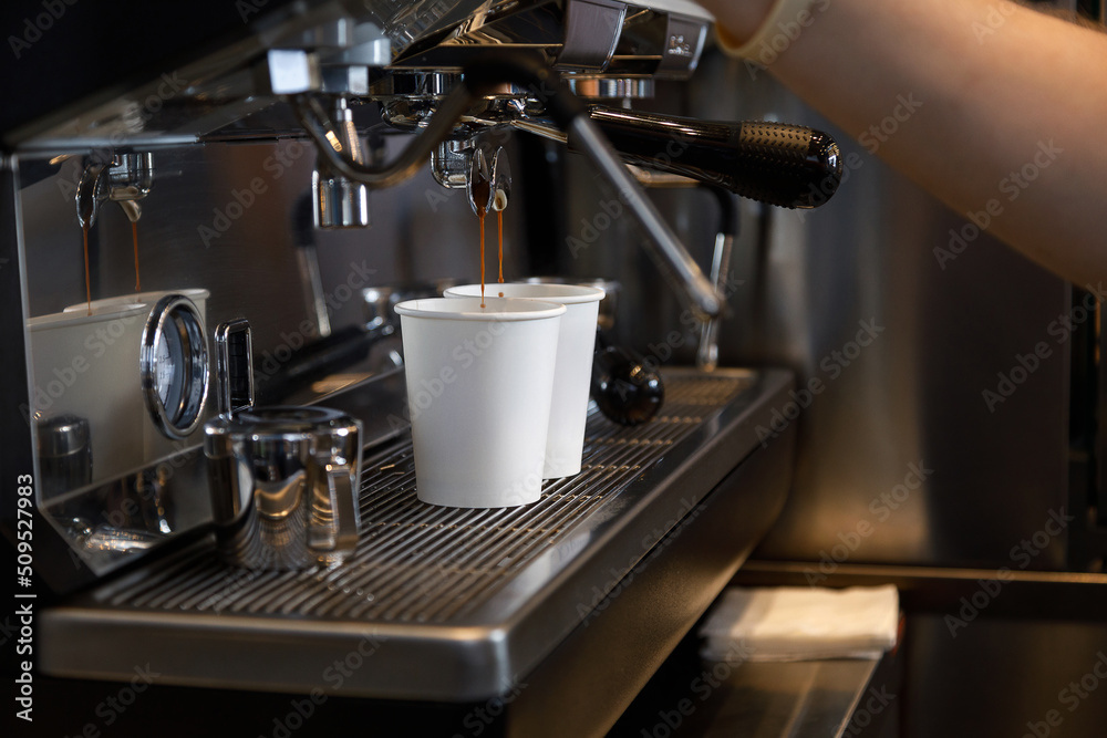 Close up view of preparing coffee espresso in automatic coffee machine in cafe Close up view of preparing coffee espresso in automatic coffee machine in cafe