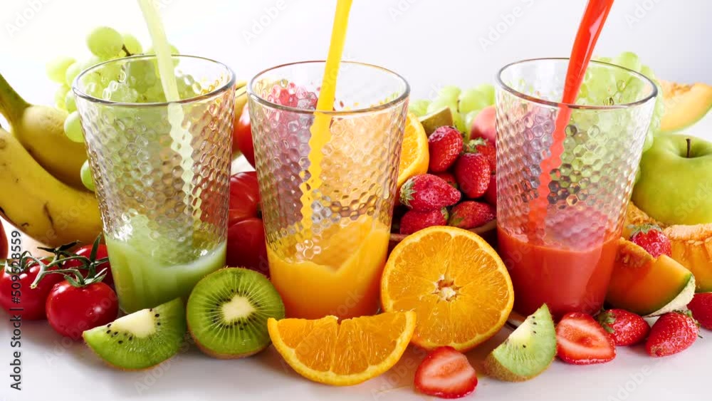 fruit juice pouring into glasses