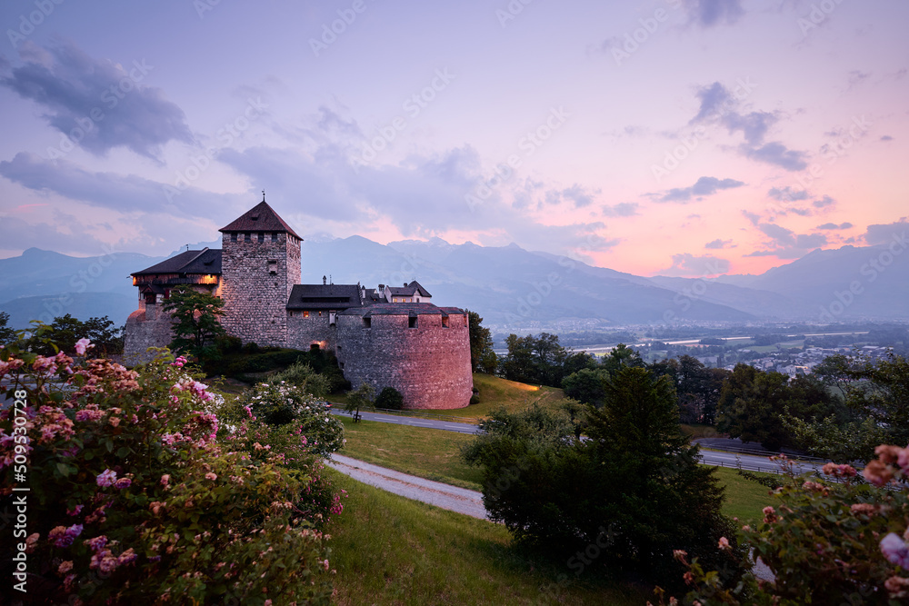 Vaduz Royal castle in Liechtenstein. Scenic landscape of old medieval castle in Alps mountains in summer. Beautiful view of Alpine nature. Vaduz Royal castle in Liechtenstein. Scenic landscape of old medieval castle in Alps mountains in summer. Beautiful view of Alpine nature.