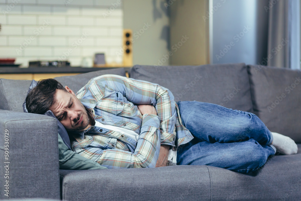 Close up photo of man sleeping on sofa at home Close up photo of man sleeping on sofa at home