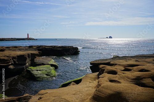 mossy rock beach and island