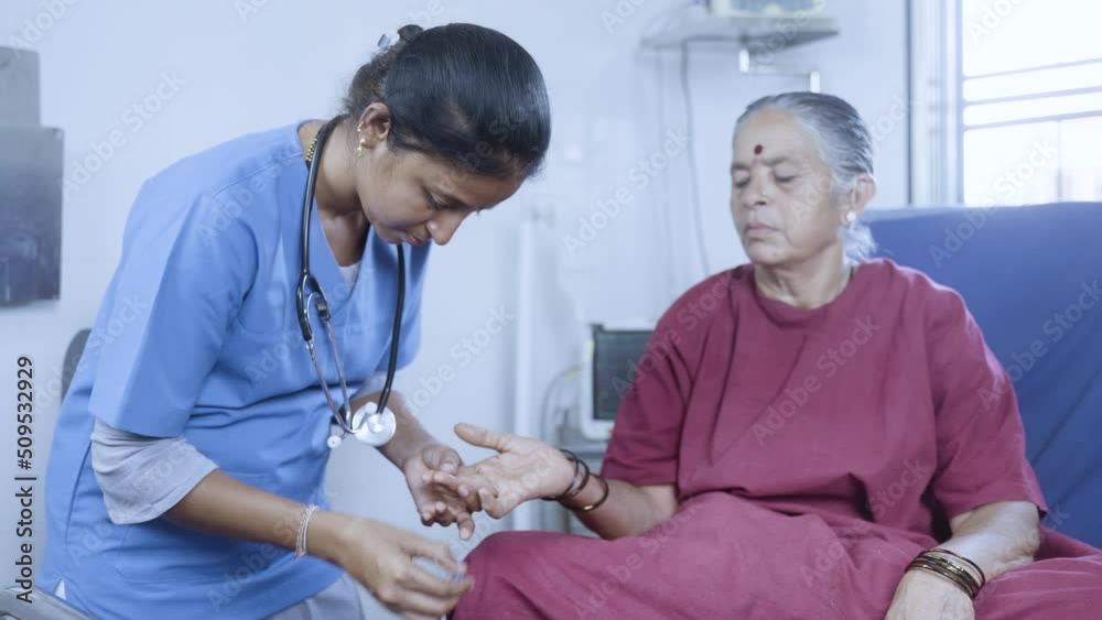 doctor or nurse checking sugar or diabetes level of hospitalised sick woman in operation gown bed - concept of health monitoring and treatment and professional occupation. doctor or nurse checking sugar or diabetes level of hospitalised sick woman in operation gown bed - concept of health monitoring and treatment and professional occupation.