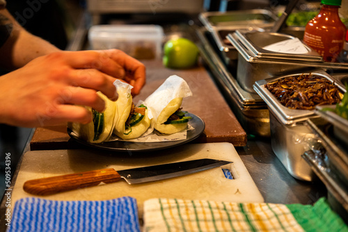 Preparing food buns in restaurant