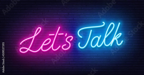 Let s Talk neon sign on brick wall background.