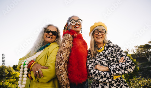 Stylish senior women smiling happily in a park