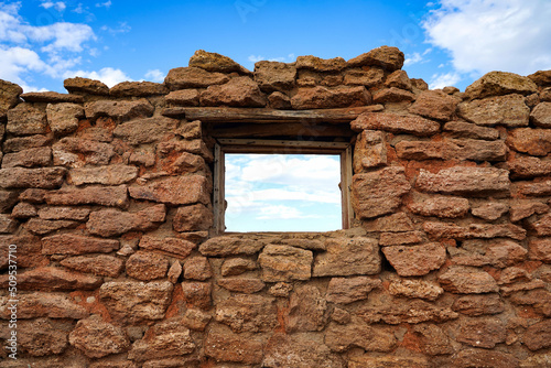 vintage wall with window wallpaper background blue sky with clouds