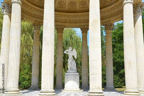 Title: The Marlborough Tower and pond in the Queen s Hamlet at Marie-Antoinette s Estate near Versailles Palace. photo