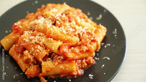 Bolognese rigatoni pasta with cheese - traditional Italian pasta photo