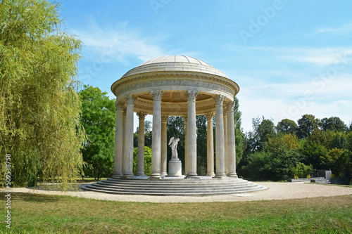 Title: The Marlborough Tower and pond in the Queen s Hamlet at Marie-Antoinette s Estate near Versailles Palace. photo