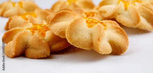 Shortbread cookies on a light background . Kurabye cookies with jam . Cookies in the shape of a flower .