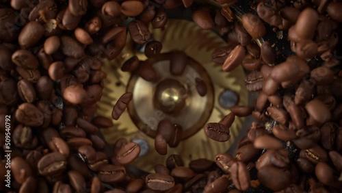 Grinding Roasted Coffee Beans Spinning in Burr Grinder in Slow Motion - Table Top View
